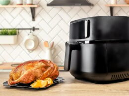 roasted whole baked duck with orange cooked in an air fryer in the kitchen