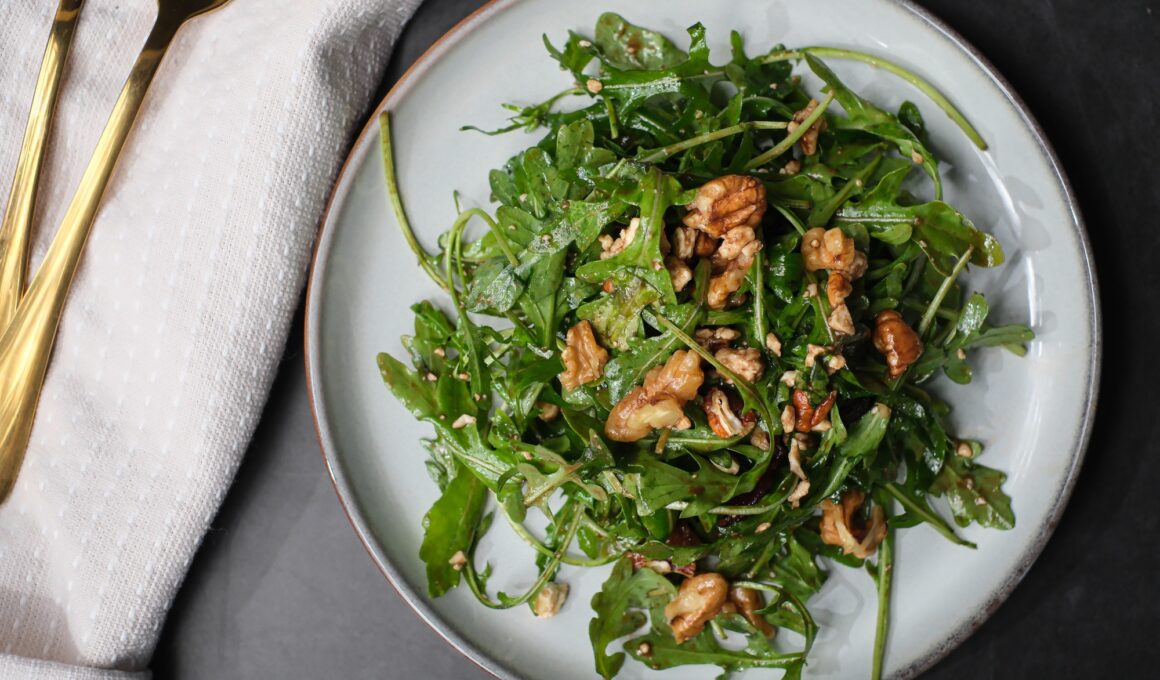 healthy eating diet. Arugula salad with olive oil and pecan.