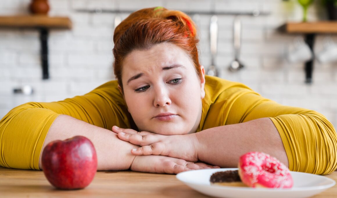 Sad plump fat woman choosing between sweets and fruits, healthy eating and junk food. The choice.