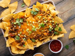 Traditional nachos with ground beef and red pepper