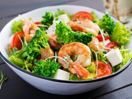 Delicious fresh salad with shrimps / prawns, broccoli, feta cheese, tomatoes