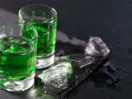 Two glasses of absinthe and melted ice cubes